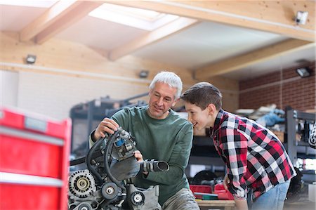 repair shop - Father and son rebuilding engine in auto repair shop Stock Photo - Premium Royalty-Free, Code: 6113-08722257