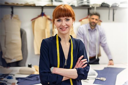 smile with confidence - Portrait confident female tailor in menswear workshop Stock Photo - Premium Royalty-Free, Code: 6113-08722292