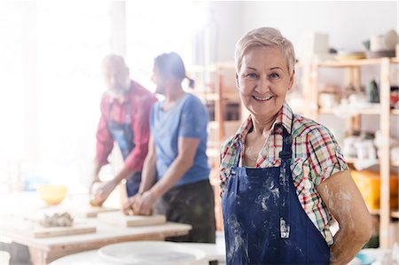 senior citizen pottery - Portrait smiling senior woman in pottery studio Stock Photo - Premium Royalty-Free, Code: 6113-08722399