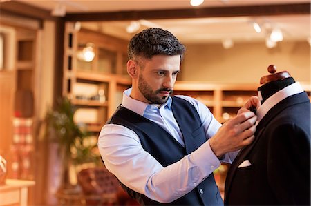 simsearch:649-05658211,k - Tailor adjusting tie on dressmakers model in menswear shop Stock Photo - Premium Royalty-Free, Code: 6113-08722336
