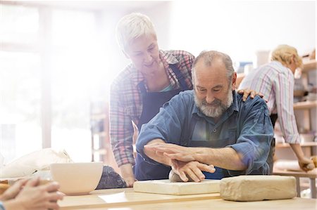 senior couple and white - Senior couple molding clay in pottery studio Stock Photo - Premium Royalty-Free, Code: 6113-08722448