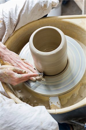 students working with tools - Overhead view woman using pottery wheel Stock Photo - Premium Royalty-Free, Code: 6113-08722462