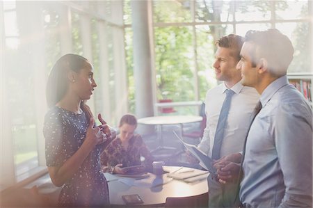 flare indoors - Business people talking in office Stock Photo - Premium Royalty-Free, Code: 6113-08882499