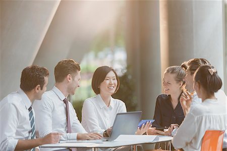 flare - Business people talking at laptop in conference room meeting Stock Photo - Premium Royalty-Free, Code: 6113-08882540