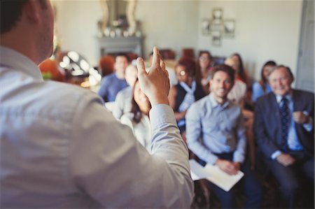 simsearch:6113-08882584,k - Business people in audience watching businessman leading business conference Stock Photo - Premium Royalty-Free, Code: 6113-08882586