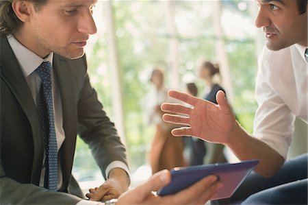 people office two man - Businessmen with digital tablet talking Stock Photo - Premium Royalty-Free, Code: 6113-08882527