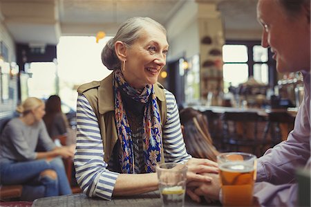 pint glass - Affectionate couple holding hands and drinking beer at table in bar Stock Photo - Premium Royalty-Free, Code: 6113-08882649