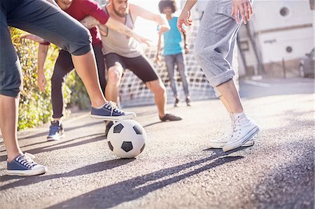 simsearch:6113-08882733,k - Friends playing soccer in summer street Stock Photo - Premium Royalty-Free, Code: 6113-08882697