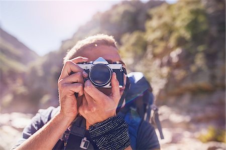 free images photographer taking photos - Young man hiking, photographing with camera Stock Photo - Premium Royalty-Free, Code: 6113-08882815