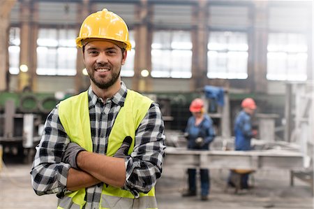 simsearch:6113-08655323,k - Portrait smiling confident steel worker in factory Photographie de stock - Premium Libres de Droits, Code: 6113-08805556