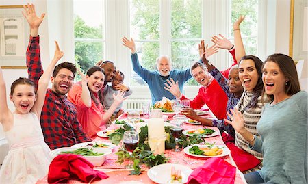 Portrait enthusiastic multi-ethnic multi-generation family waving at Christmas dinner table Foto de stock - Sin royalties Premium, Código: 6113-08805690