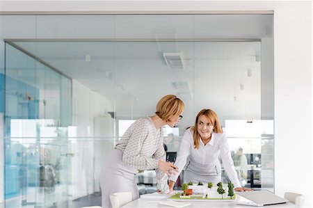 expert (female) - Female architects discussing model in conference room Stock Photo - Premium Royalty-Free, Code: 6113-08805765