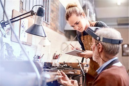 senior lady 70 - Jeweler teaching apprentice in workshop Stock Photo - Premium Royalty-Free, Code: 6113-08805715