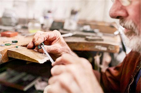 Close up male jeweler making jewelry in workshop Stock Photo - Premium Royalty-Free, Code: 6113-08805718