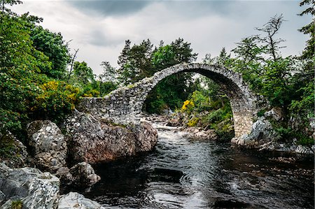 stone forest - Arched footbridge over tranquil stream, Carrbridge, Scotland Stock Photo - Premium Royalty-Free, Code: 6113-08805834