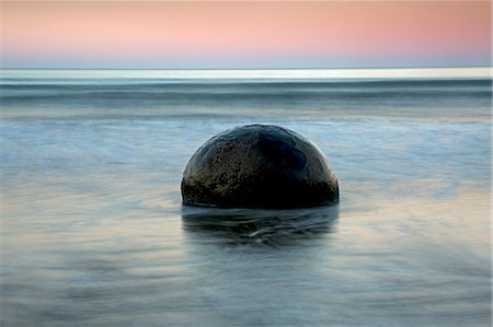 south island round rock - Tranquil seascape and boulder, Moeraki Boulders, South Island, New Zealand Stock Photo - Premium Royalty-Free, Code: 6113-08805839