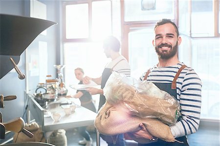 roasting (meat) - Portrait smiling, confident male coffee roaster Stock Photo - Premium Royalty-Free, Code: 6113-08943858