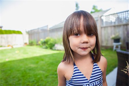 simsearch:693-07912147,k - Portrait girl in bathing suit in summer backyard Stock Photo - Premium Royalty-Free, Code: 6113-08943827