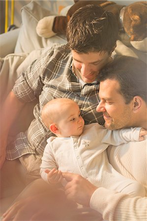 Affectionate male gay parents and son cuddling Stock Photo - Premium Royalty-Free, Code: 6113-08947219