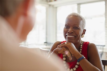 simsearch:6113-09192020,k - Smiling senior woman dining at restaurant Stock Photo - Premium Royalty-Free, Code: 6113-08985799