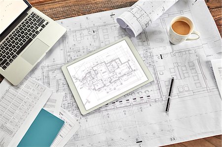 simsearch:693-06325161,k - Still life digital and complex paper blueprints with coffee and laptop Stock Photo - Premium Royalty-Free, Code: 6113-08985913