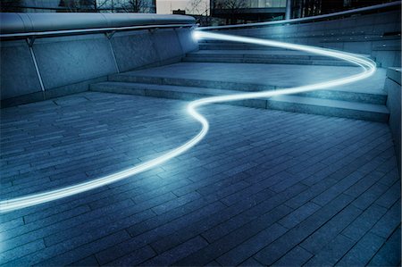 Fiber optic light trail communication technology streaming, concept Foto de stock - Sin royalties Premium, Código: 6113-08985926