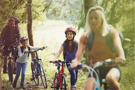 simsearch:6113-09168871,k - Family mountain biking in woods Stock Photo - Premium Royalty-Free, Code: 6113-08909852