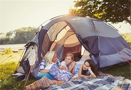 simsearch:6113-07906368,k - Mother and daughters talking and relaxing in tent at campsite Stock Photo - Premium Royalty-Free, Code: 6113-08909942