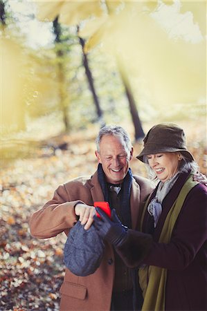 senior woods - Grandparents using cell phone in autumn park Stock Photo - Premium Royalty-Free, Code: 6113-08910114