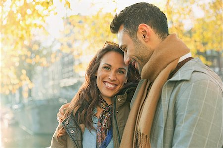 simsearch:6113-08927751,k - Portrait smiling, affectionate couple on autumn street Stock Photo - Premium Royalty-Free, Code: 6113-08927662