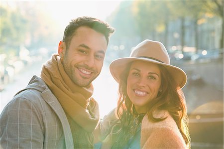 simsearch:6113-08927751,k - Portrait smiling young couple along sunny autumn canal Stock Photo - Premium Royalty-Free, Code: 6113-08927780