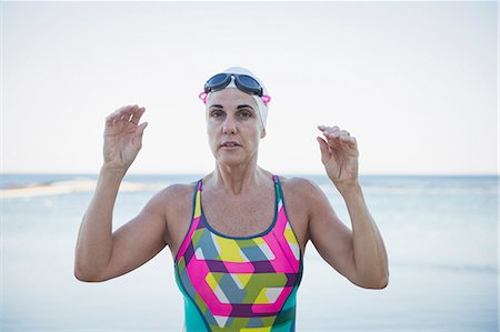 simsearch:6113-09058364,k - Portrait serious mature female open water swimmer at ocean Stock Photo - Premium Royalty-Free, Code: 6113-09058326