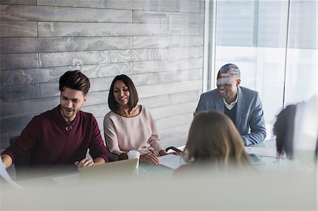 simsearch:6113-09058702,k - Smiling business people planning in conference room meeting Stock Photo - Premium Royalty-Free, Code: 6113-09058698