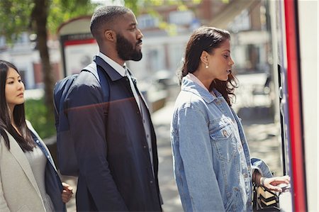 risk finance - People waiting in queue at ATM Stock Photo - Premium Royalty-Free, Code: 6113-09058613