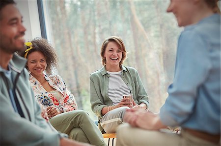 doctor's office - People smiling and laughing in group therapy session Stock Photo - Premium Royalty-Free, Code: 6113-09058776
