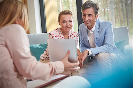 simsearch:6113-09058812,k - Therapist showing digital tablet to couple in couples therapy counseling session Stock Photo - Premium Royalty-Free, Code: 6113-09058782