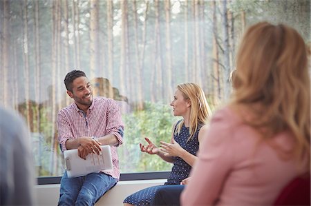 simsearch:6113-09058812,k - Male therapist listening to talking woman in group therapy session Stock Photo - Premium Royalty-Free, Code: 6113-09058798