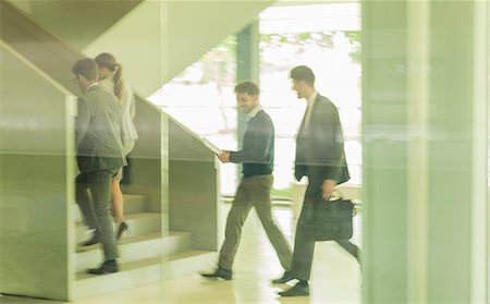 simsearch:6113-09058702,k - Business people walking, ascending stairs in office Stock Photo - Premium Royalty-Free, Code: 6113-09058941