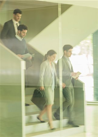 simsearch:6113-09058702,k - Business people walking, descending stairs in office Stock Photo - Premium Royalty-Free, Code: 6113-09058931