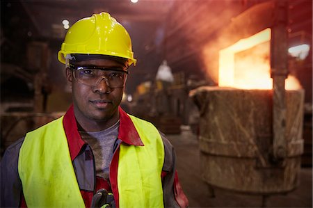 Portrait serious, confident steelworker in steel mill Stock Photo - Premium Royalty-Free, Code: 6113-09059058