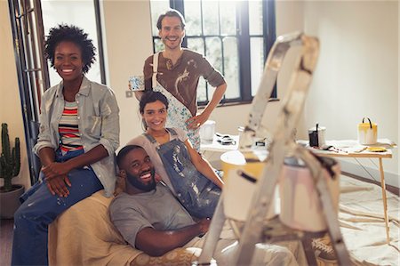 Portrait smiling young friends painting living room Stock Photo - Premium Royalty-Free, Code: 6113-09059271