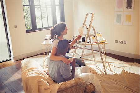 simsearch:6113-09059323,k - Young couple viewing paint swatches, painting living room Stock Photo - Premium Royalty-Free, Code: 6113-09059350