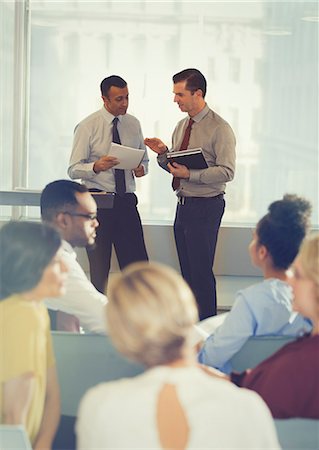 simsearch:6124-08768365,k - Businessmen talking in conference audience Stock Photo - Premium Royalty-Free, Code: 6113-09005003