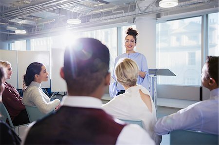 Businesswoman leading conference presentation, answering audience questions Stock Photo - Premium Royalty-Free, Code: 6113-09005001