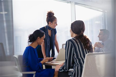 Business people talking, working in conference room meeting Stock Photo - Premium Royalty-Free, Code: 6113-09005005