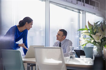 simsearch:6113-09004924,k - Business people working at laptop, talking in conference room meeting Stock Photo - Premium Royalty-Free, Code: 6113-09005034