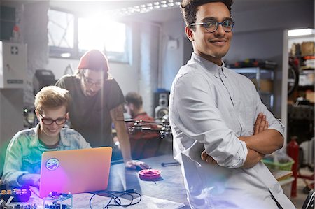 robotique - Portrait smiling, confident male designer in workshop Photographie de stock - Premium Libres de Droits, Code: 6113-09005168