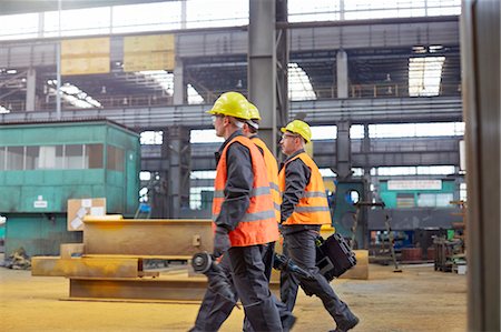 simsearch:6113-07565427,k - Male workers walking in steel factory Stock Photo - Premium Royalty-Free, Code: 6113-09027542