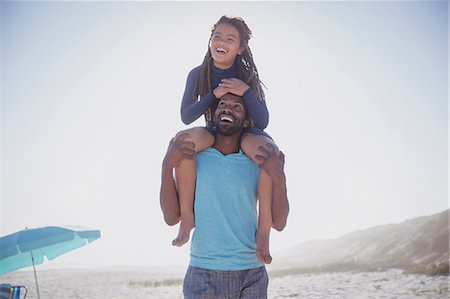 simsearch:6113-07808098,k - Playful father carrying daughter on shoulders on sunny summer beach Photographie de stock - Premium Libres de Droits, Code: 6113-09027654