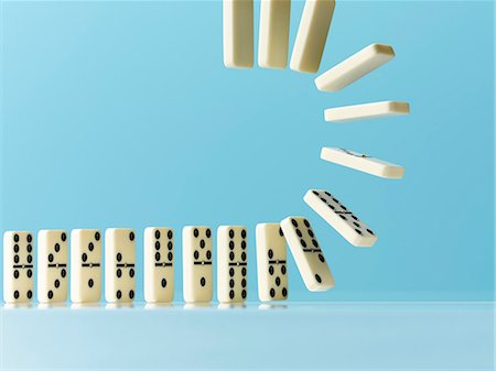 simsearch:6113-07565319,k - Flipping dominos on blue background Stock Photo - Premium Royalty-Free, Code: 6113-09027825